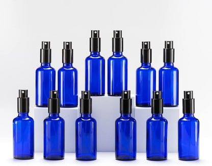 YIZHAO Blue Glass Spray Bottles 2oz, with Small Fine Mist Spray, Metal Cap, Refillable for Essential Oil,Travel,Cleaning,Perfume,Aromatherapy,Makeup – 12 Pcs